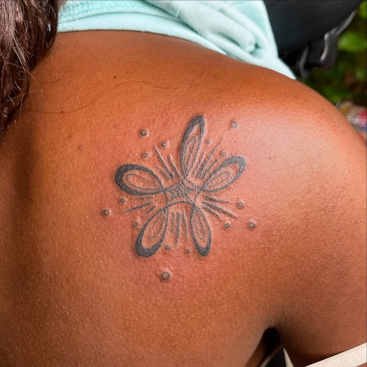 Fine line ornamental tattoo